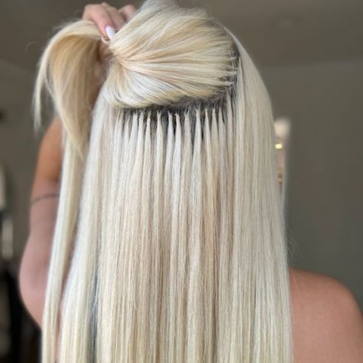 K-Tip hair extensions applied to fine blonde hair, showcasing natural movement and blend, emphasizing length and volume enhancement at Refined Beauty Boutique in Naperville, IL.